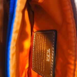 Tumi Voyageur 3 Pocket Wristlet.